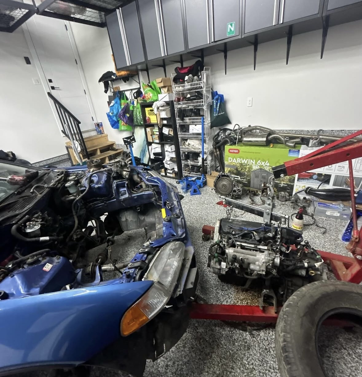 Mechanic running diagnostics on a luxury car
